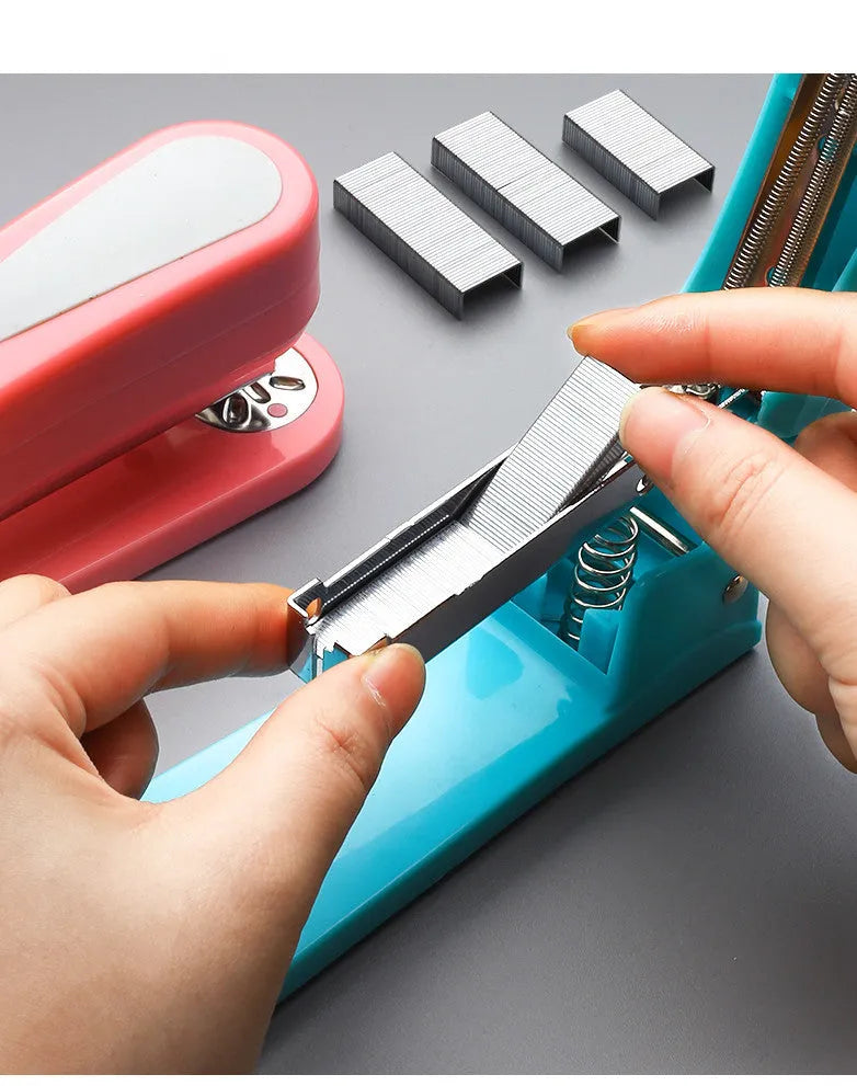 360-degree rotatable desk stapler in multiple colours showing metal nail outlet and centre binding function.