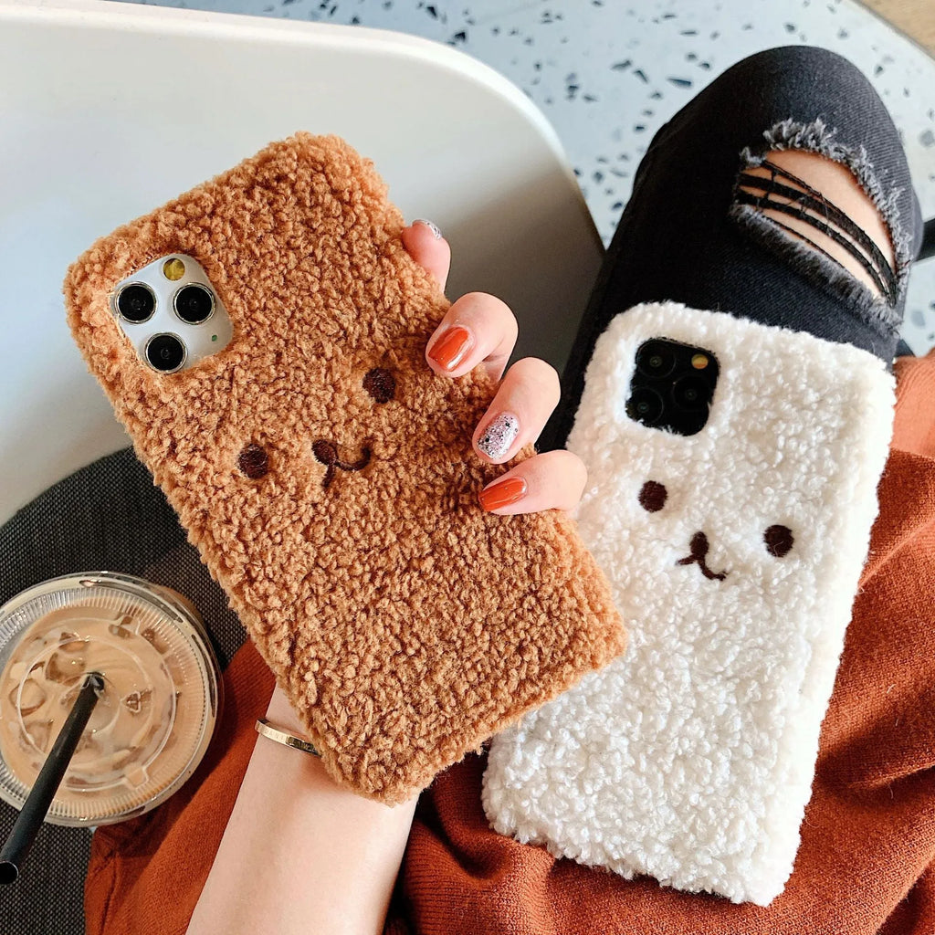 Brown soft TPU iPhone case featuring a raised plush bear face with embroidered details.