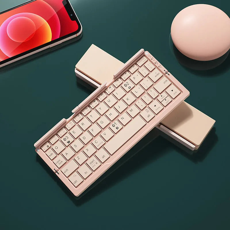 Aluminium foldable Bluetooth keyboard open with phone propped on stand and closed for pocket storage
