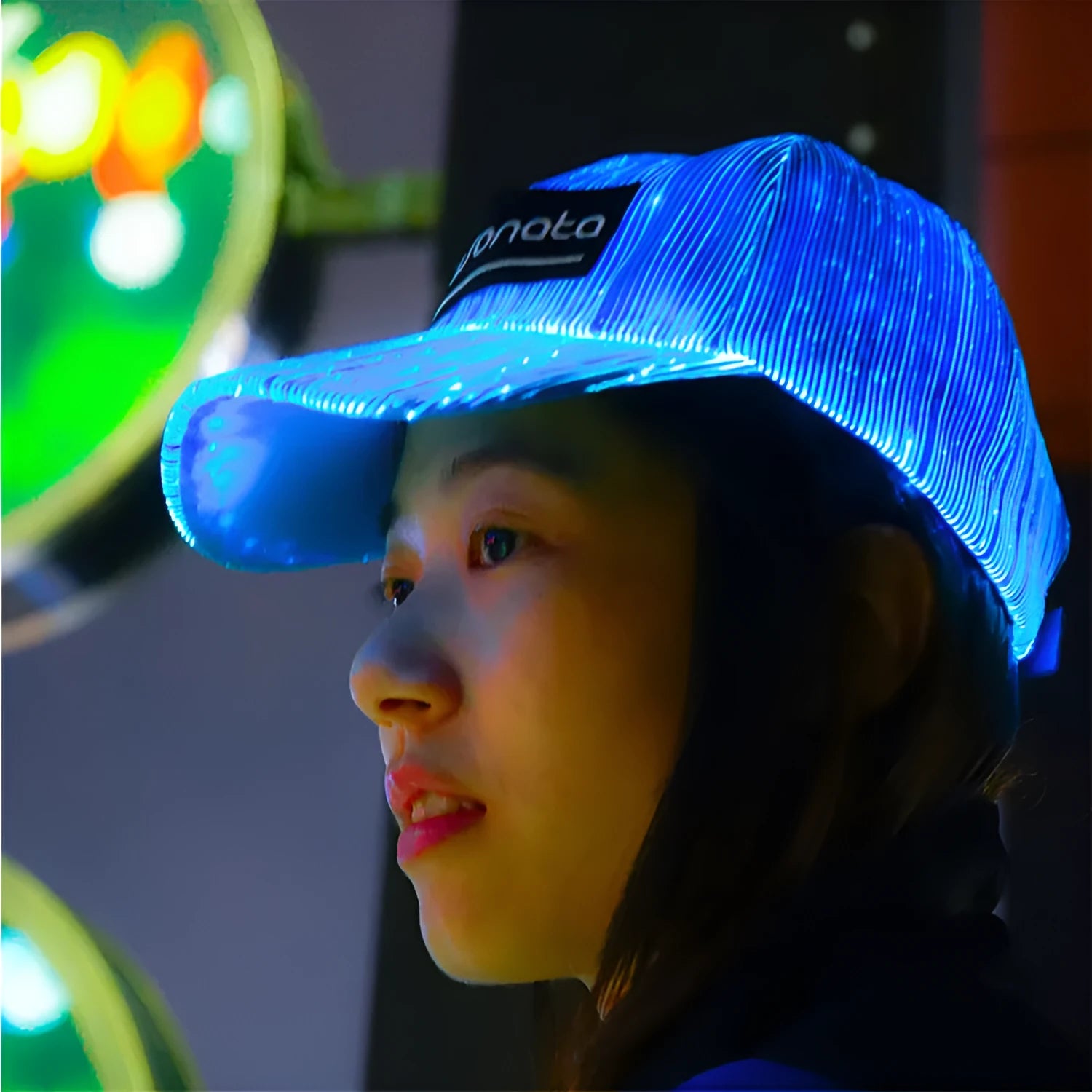 White unisex luminous baseball cap with fiber optic fabric LED glow against dark background