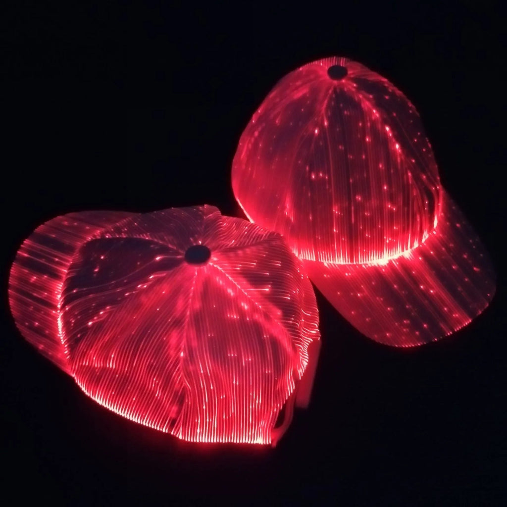 White unisex luminous baseball cap with fiber optic fabric LED glow against dark background
