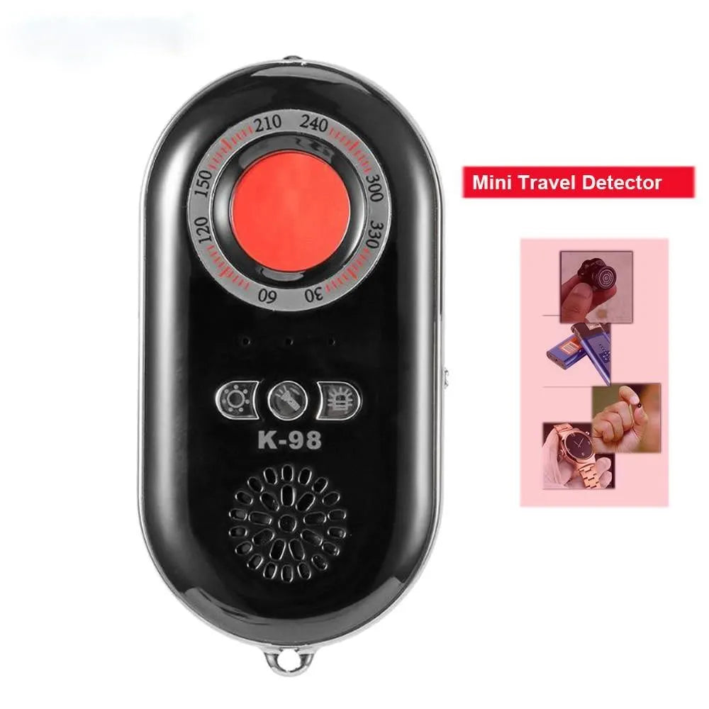 Compact black wireless signal detector with anti-theft alarm, shown next to a ruler for scale.
