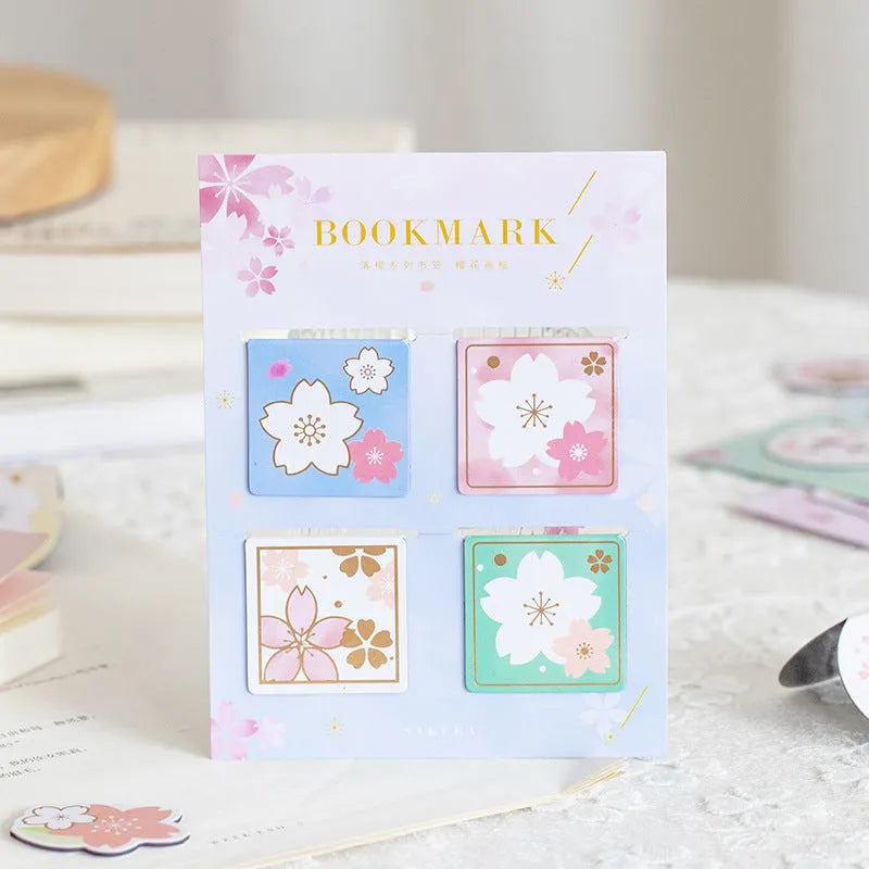 Set of four Yanji cherry blossom magnetic bookmarks showing different sakura designs.
