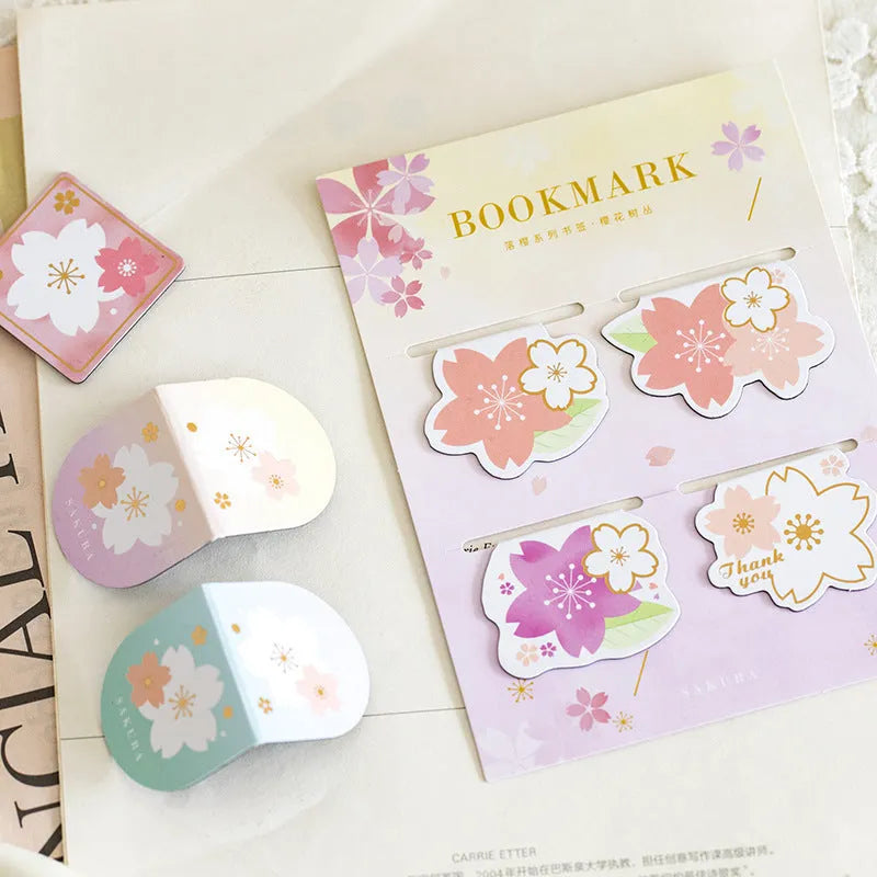 Set of four Yanji cherry blossom magnetic bookmarks showing different sakura designs.