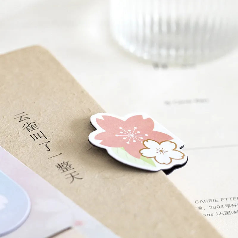Set of four Yanji cherry blossom magnetic bookmarks showing different sakura designs.