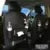 PU leather car seat back hanging organiser bag with multiple pockets in various colours.