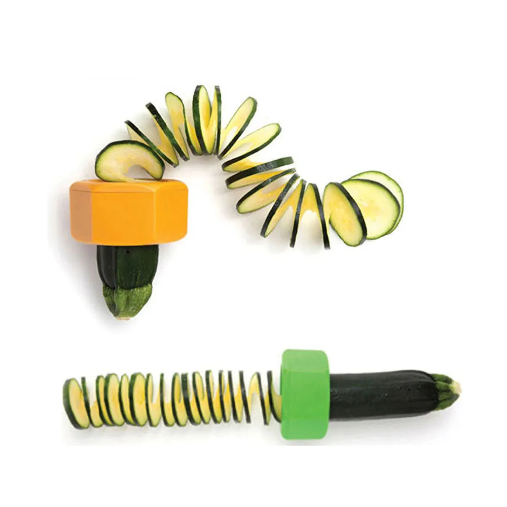 Yellow and green plastic spiral vegetable cutter for slicing cucumbers on a kitchen counter