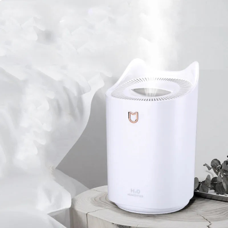 Double spray humidifier with three fog outlets in coral pink or white colour with USB power cable