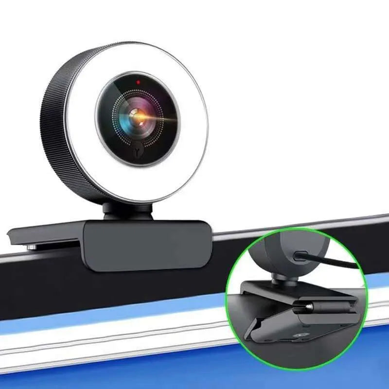 Black high-definition USB webcam with built-in fill light for video conferencing on a PC.