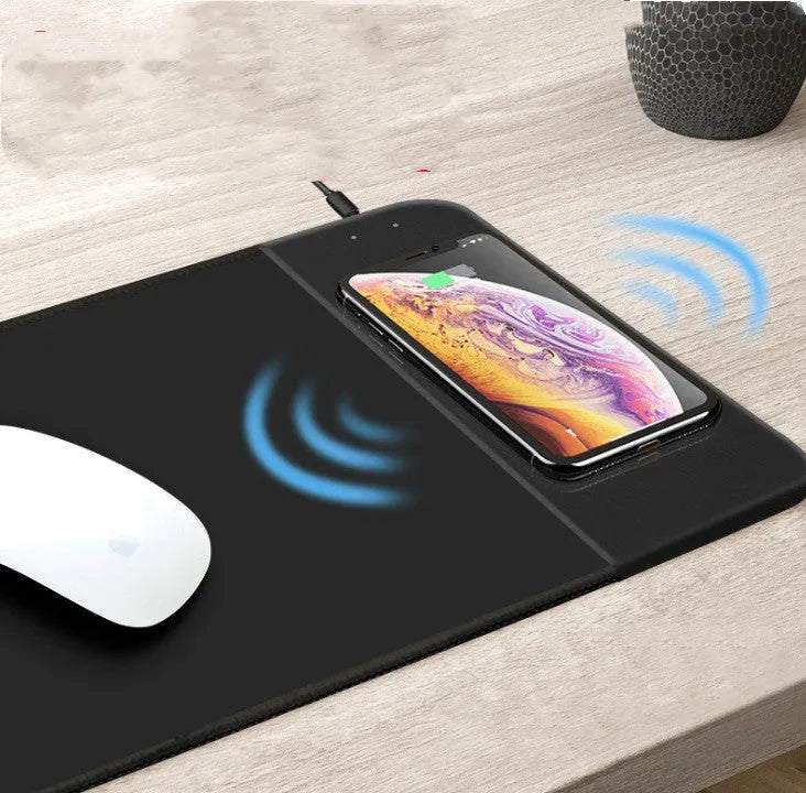Wireless charging mouse pad with RGB lighting and cartoon design on black cloth surface