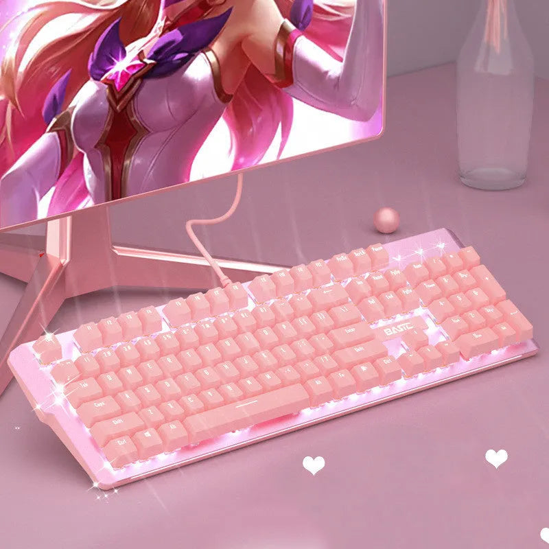 Pink wired mechanical keyboard and matching mouse for PC gaming on a desk.