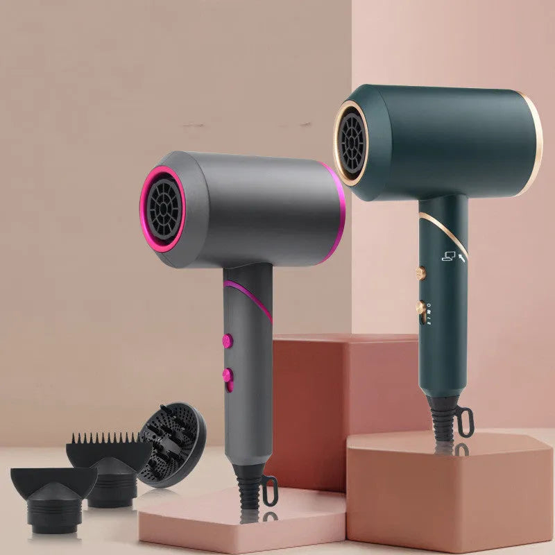 Foldable hair dryer in dark green with gold trim, showing concentrator nozzle and diffuser attachment.
