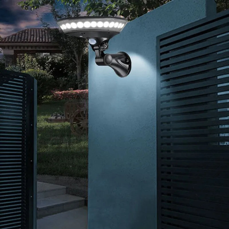 White 360-degree solar garden light with integrated solar panel on top, suitable for outdoor pathways.