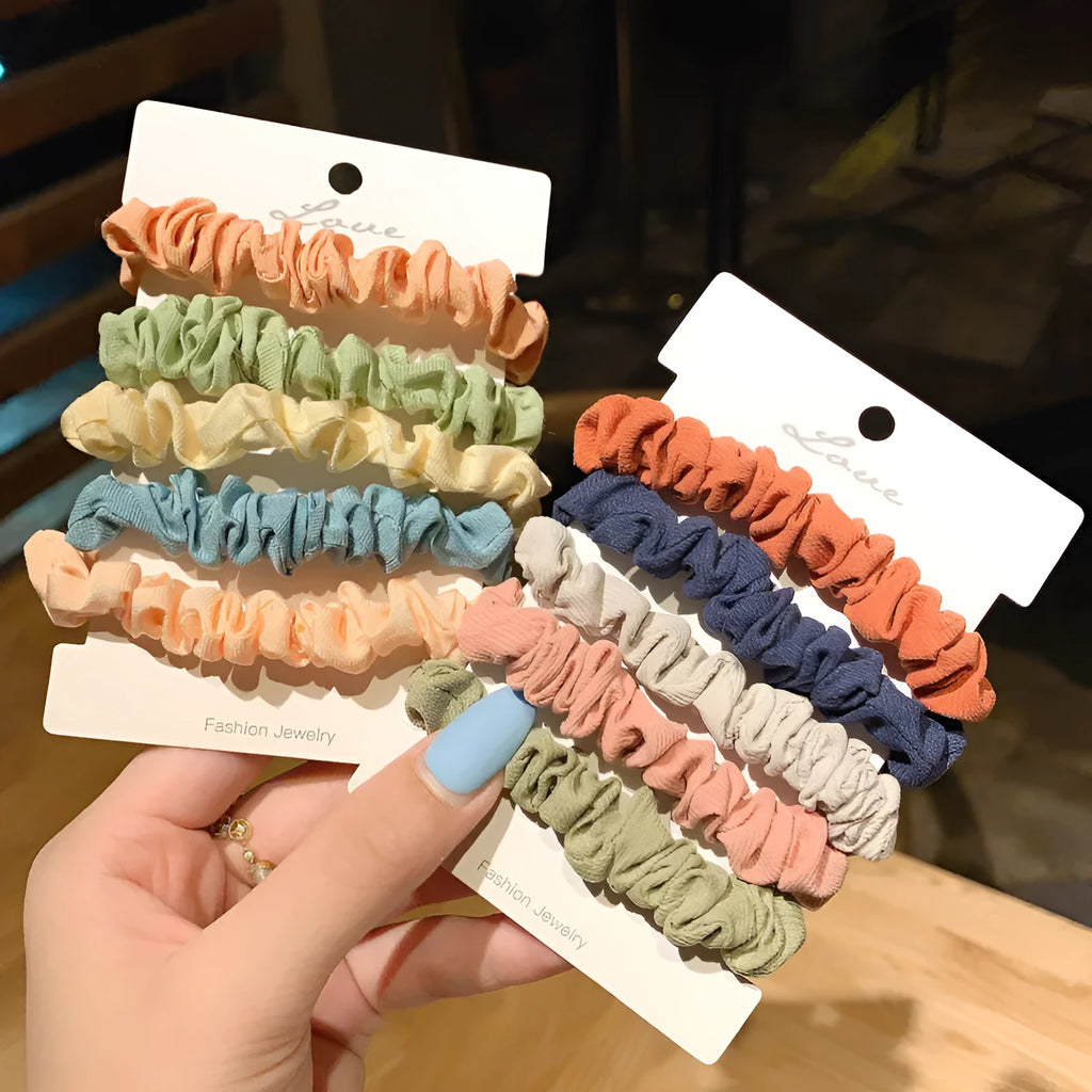 Assorted children's hair rings and head ropes in autumn colours and macaron pastels.