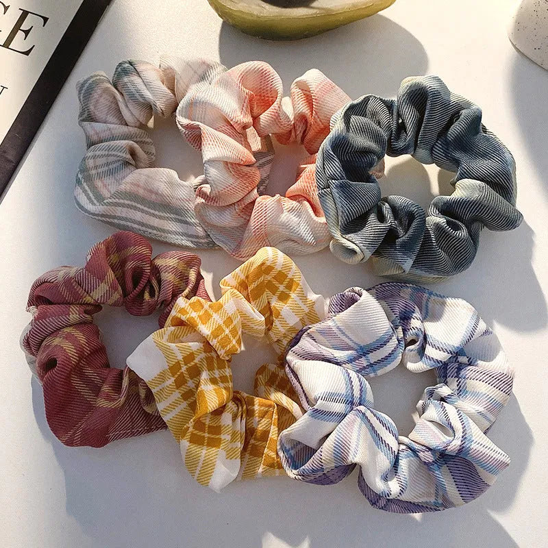 Assorted children's hair rings and head ropes in autumn colours and macaron pastels.