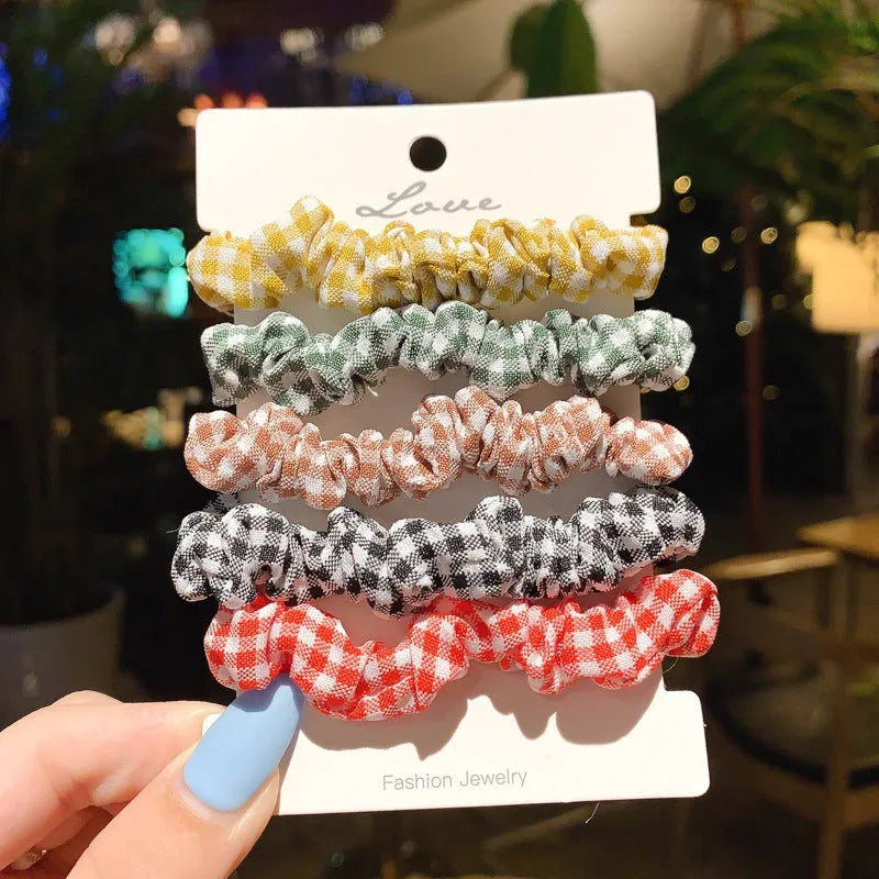 Assorted children's hair rings and head ropes in autumn colours and macaron pastels.