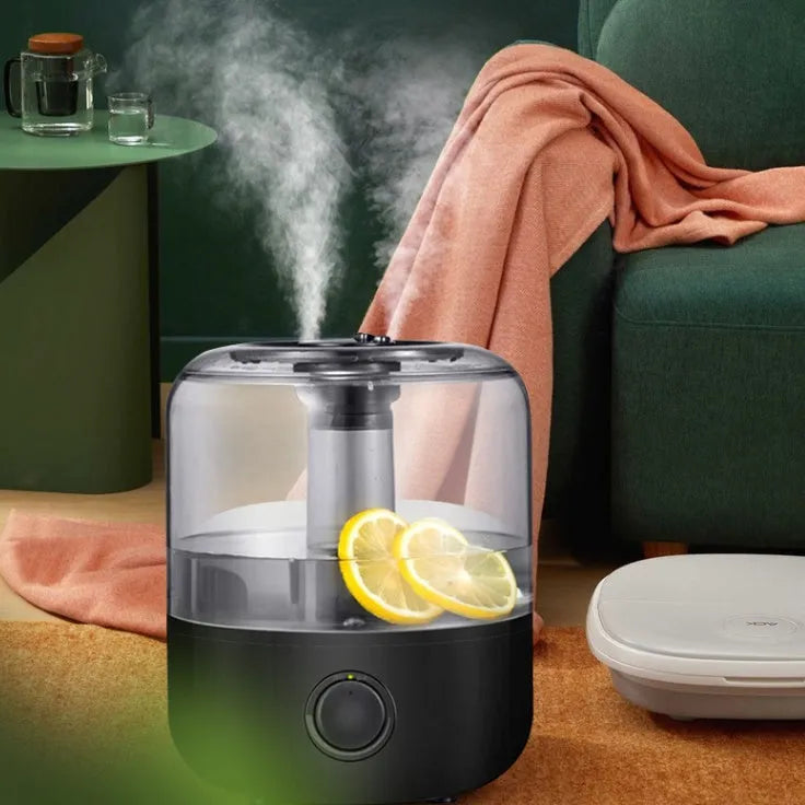 Small white or black tabletop humidifier with 3-litre water tank and quiet motor for bedroom use.