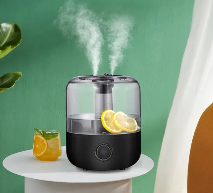 Small white or black tabletop humidifier with 3-litre water tank and quiet motor for bedroom use.