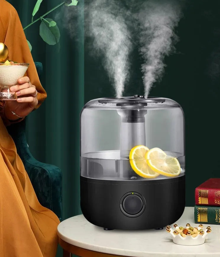 Small white or black tabletop humidifier with 3-litre water tank and quiet motor for bedroom use.