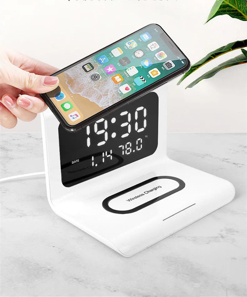 Black wireless charger alarm clock showing digital time, date, temperature and humidity display