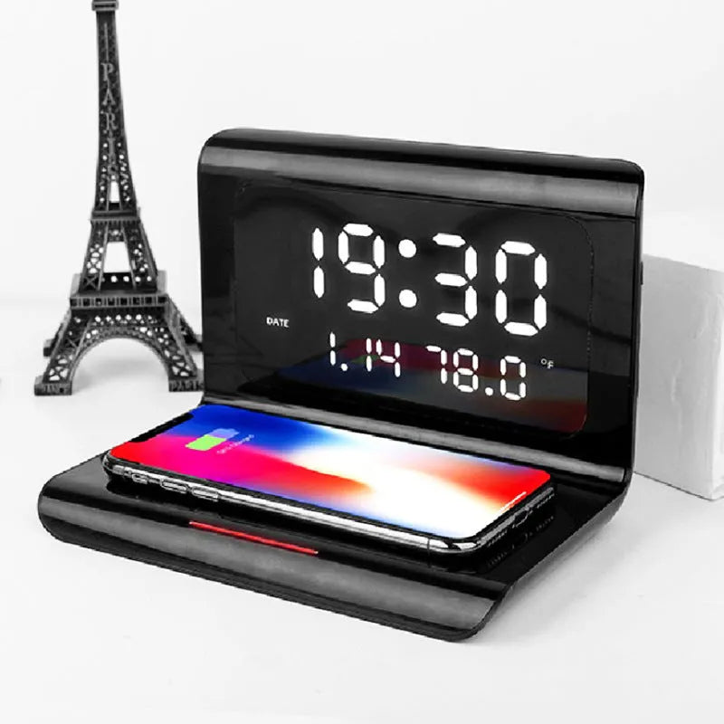 Black wireless charger alarm clock showing digital time, date, temperature and humidity display
