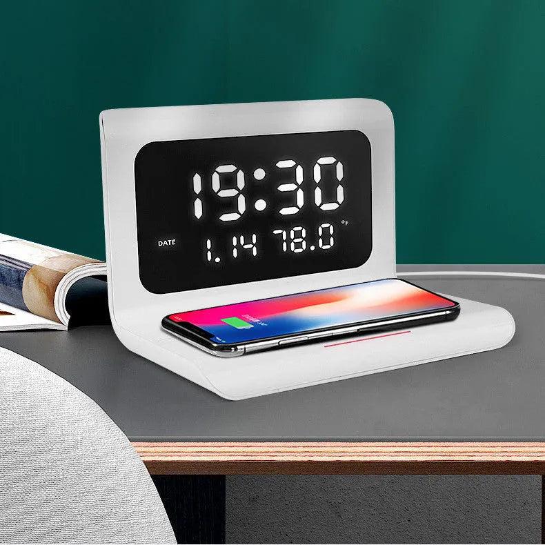 Black wireless charger alarm clock showing digital time, date, temperature and humidity display