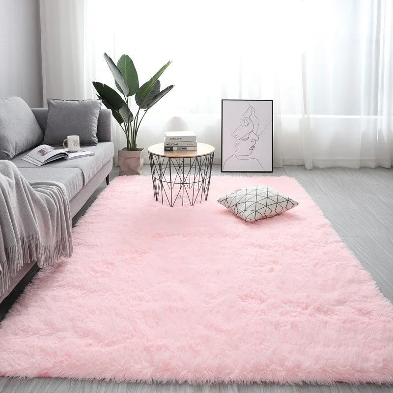 Nordic style plush rectangle carpet in a light colour on a wooden floor