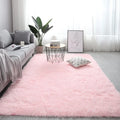 Nordic style plush rectangle carpet in a light colour on a wooden floor