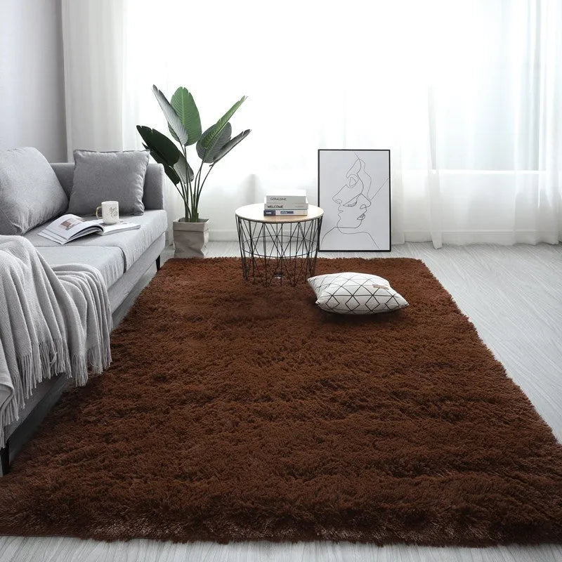 Nordic style plush rectangle carpet in a light colour on a wooden floor