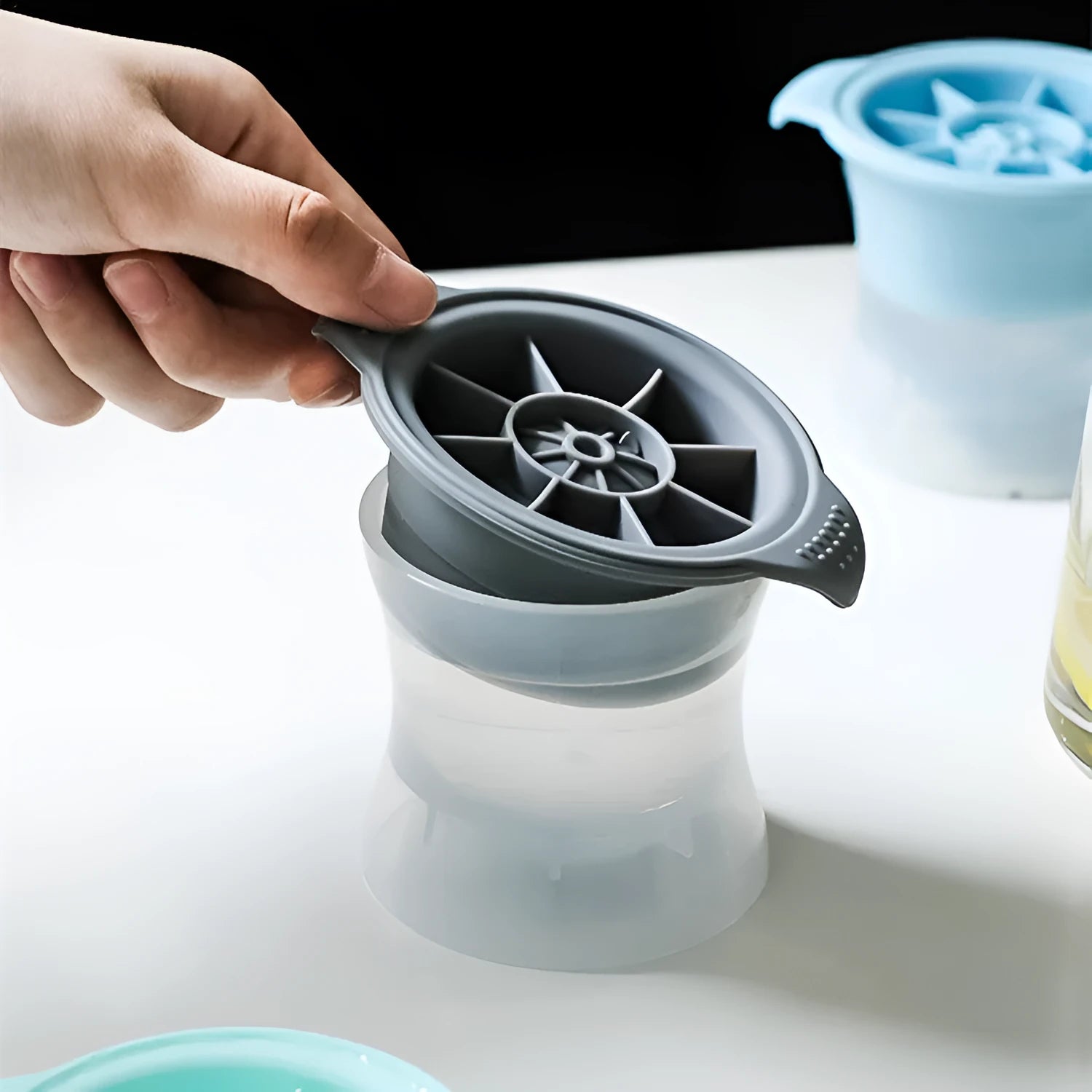 Silicone ice tray for making large ice hockey shapes, pentagons, and spheres in assorted colours