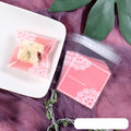 Pink self-adhesive plastic packaging bag for handmade soap and snacks with gusset.