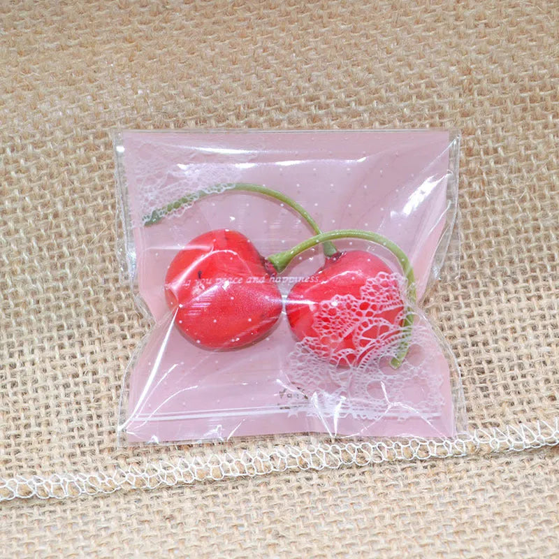 Pink self-adhesive plastic packaging bag for handmade soap and snacks with gusset.