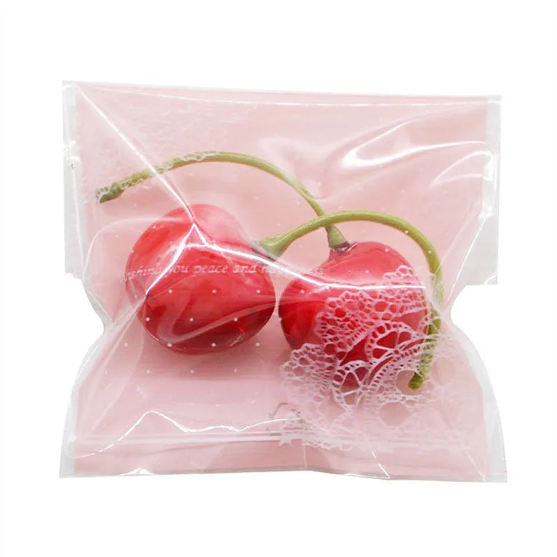 Pink self-adhesive plastic packaging bag for handmade soap and snacks with gusset.
