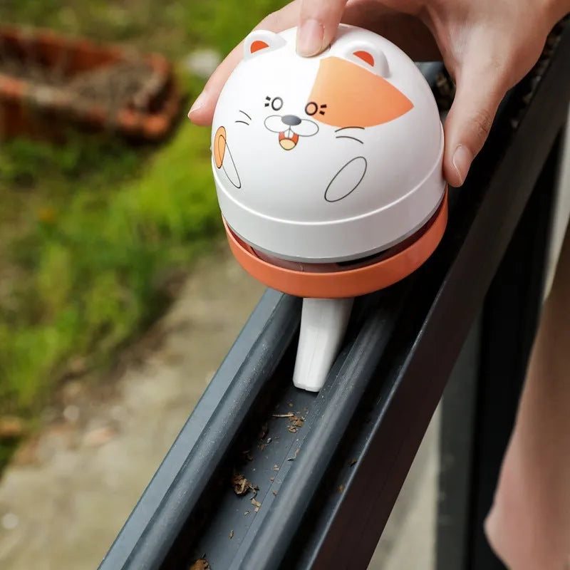 Portable mini desktop vacuum cleaner with flat nozzle attachment for keyboard cleaning