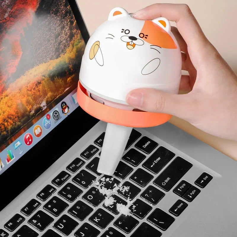Portable mini desktop vacuum cleaner with flat nozzle attachment for keyboard cleaning