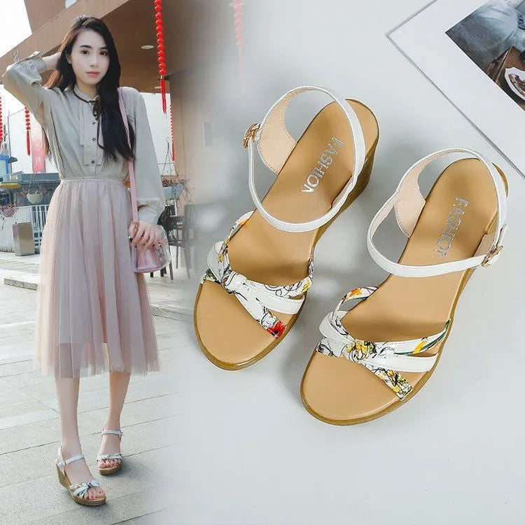 Pink and white women's wedge sandals with a buckle and non-slip platform sole.