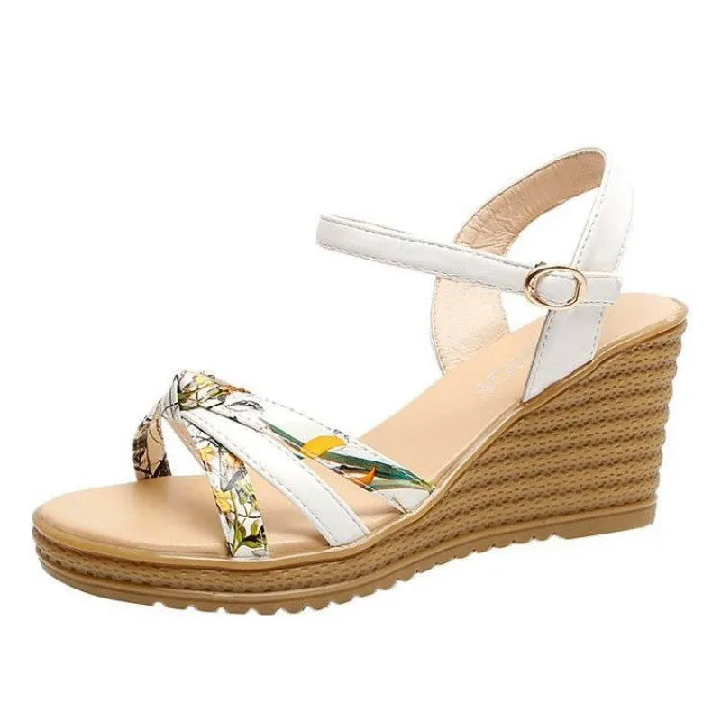 Pink and white women's wedge sandals with a buckle and non-slip platform sole.