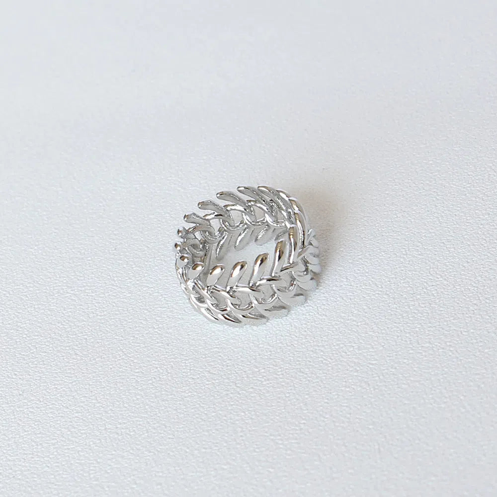 Copper platinum plated couple ring with three-ring gem design in style A on a neutral background