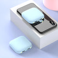 Compact black plastic 20000 mAh power bank with an LED flashlight, shown with dimensions.