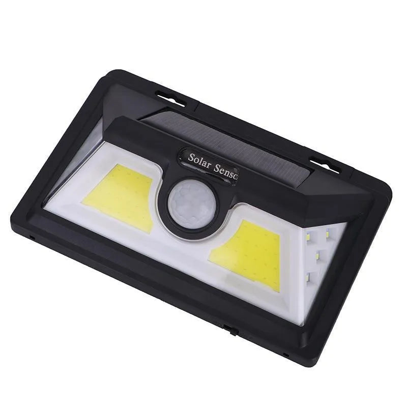 White outdoor solar garden lamp with integrated solar panel on top and LED light array.
