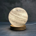 Nordic style table lamp with glass shade in one of seven colours, powered by USB cable.