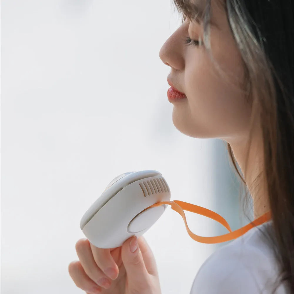 Portable hanging neck fan with USB charging port showing three speed controls and cute animal design