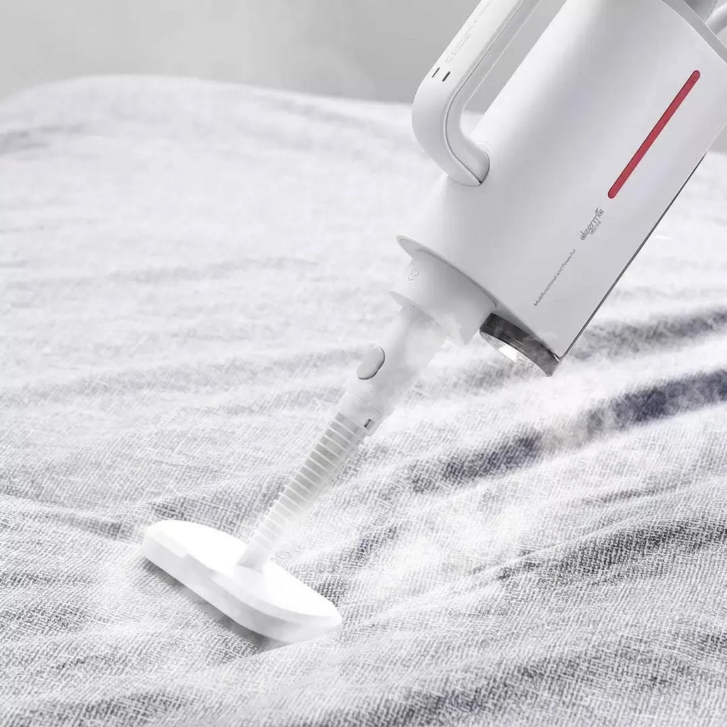 Deerma DEM-ZQ610 white steam cleaner unit with assorted brush heads including a glass scraper and mop.