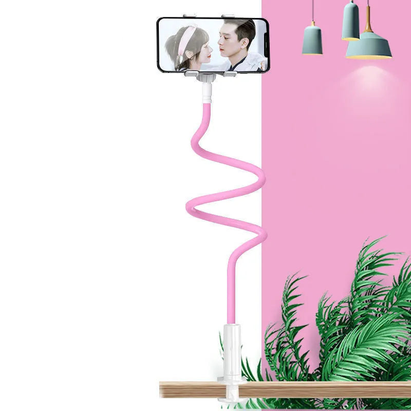 Blue universal mobile phone holder with bendable memory alloy hose on a wooden bedside table.