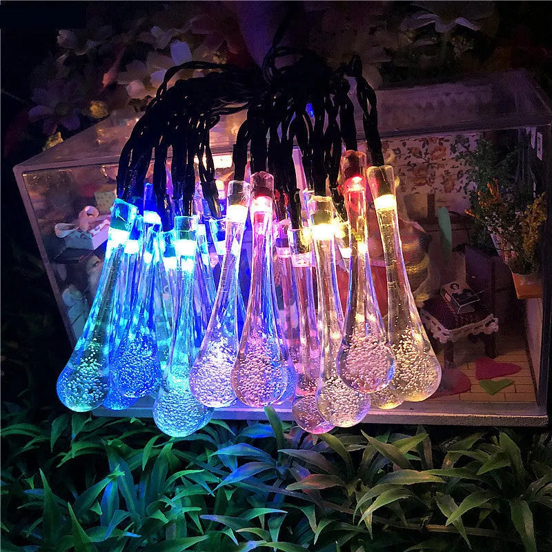 Solar-powered outdoor LED string lights with water drop shaped pendants on a 6.5 metre cable.