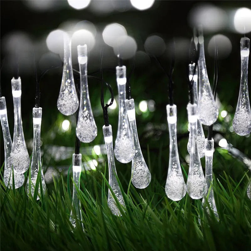 Solar-powered outdoor LED string lights with water drop shaped pendants on a 6.5 metre cable.