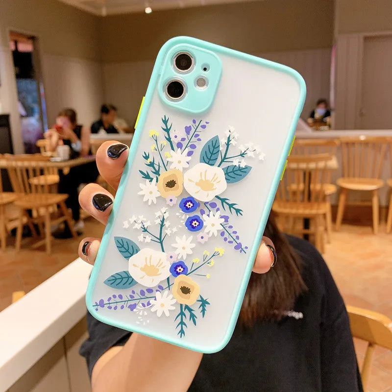 Matte TPU iPhone case with floral cartoon design in pink lavender, blue lavender, and blue flower colour options.
