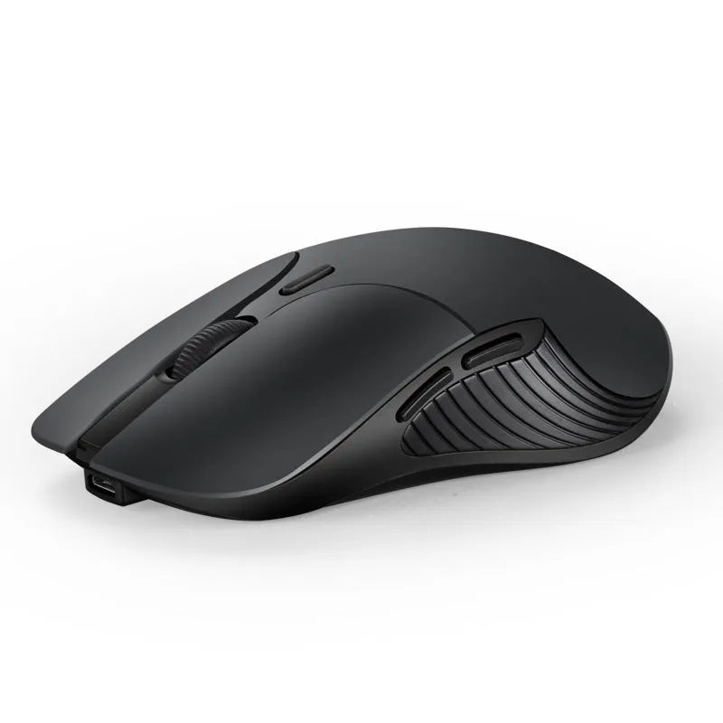 Blue rechargeable wireless voice translator mouse on a desk next to a laptop.