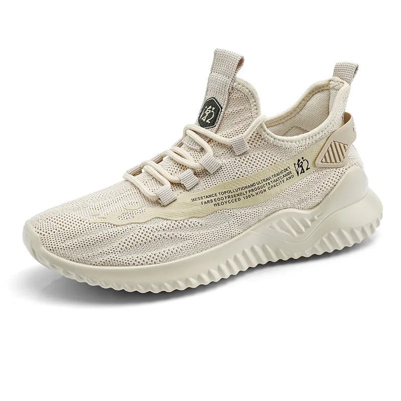 Men's white low-top mesh sports trainers with rubber sole and round toe on a plain background