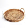Round handwoven rattan storage basket with wooden handle showing three size options